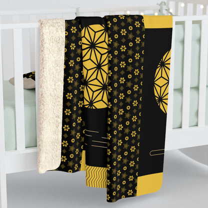 Black and yellow patterned fabric draped over a white crib