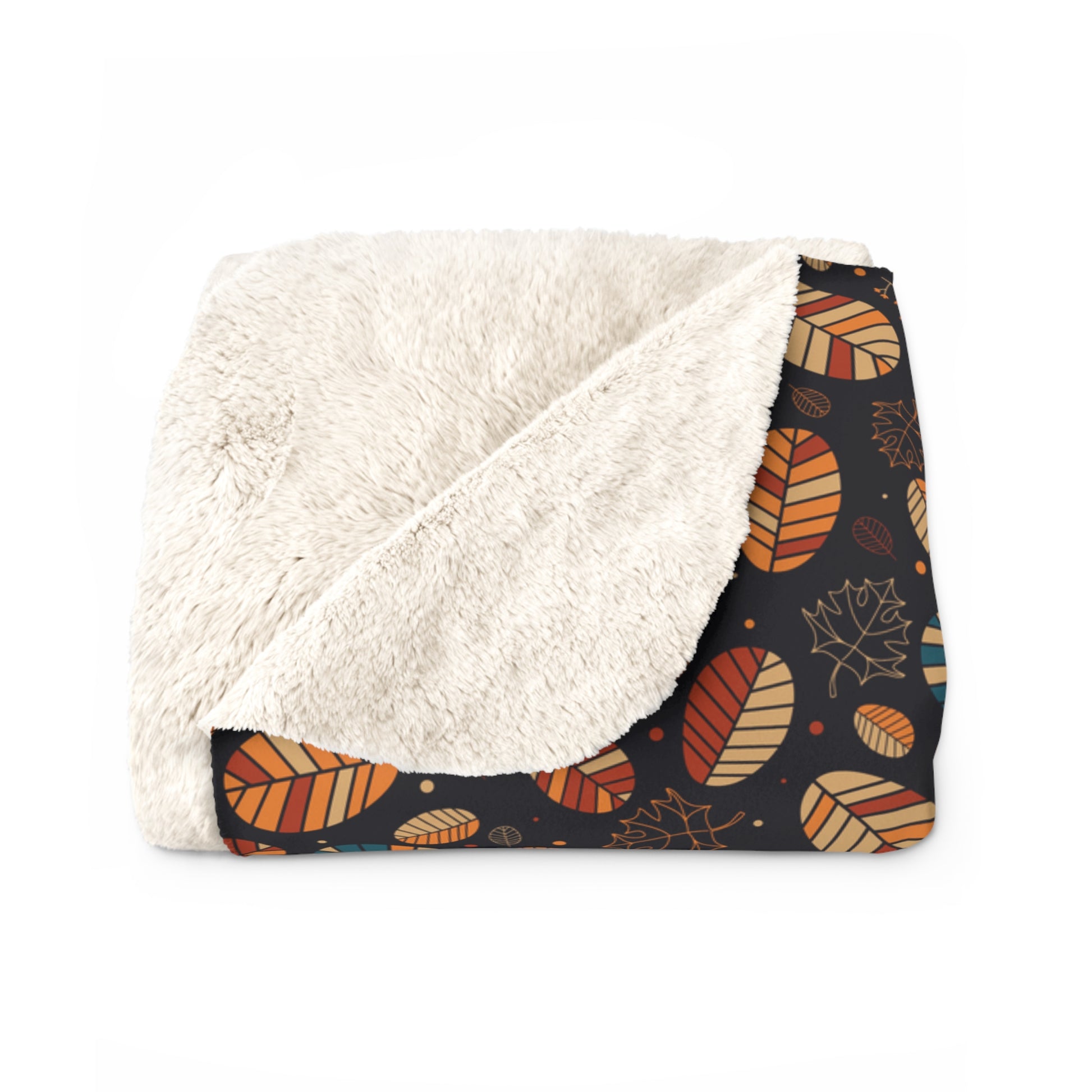 A folded throw blanket featuring a plush cream sherpa fleece backing and an autumn-themed printed fabric on the front. The print showcases orange, brown, and beige leaves on a dark navy background.