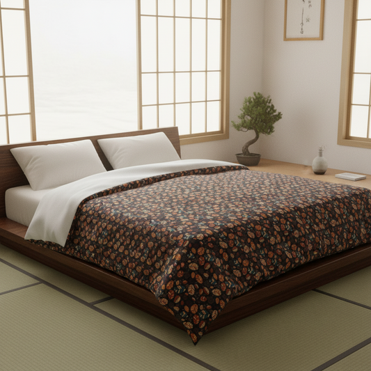 A Japanese-style platform bed with a dark wood frame, dressed in a dark brown floral-patterned quilt and white bedding, set in a minimalist room with tatami mats and shoji screens.