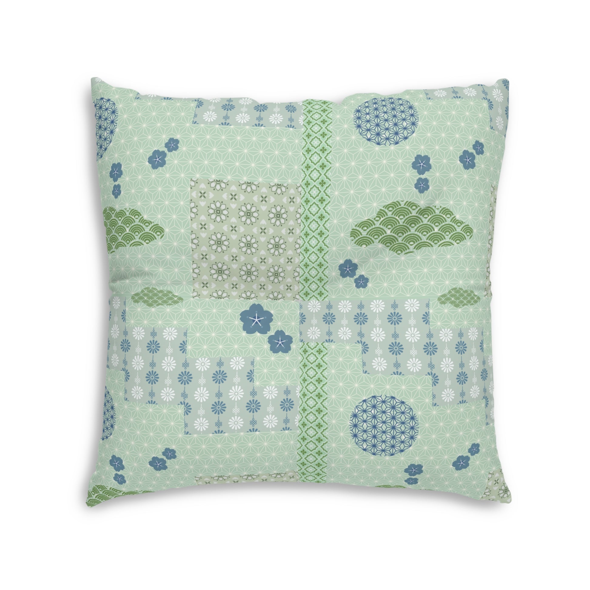 A square decorative throw pillow featuring a patchwork-style Japanese-inspired pattern in sage green, light blue, and white, set against a plain white background.