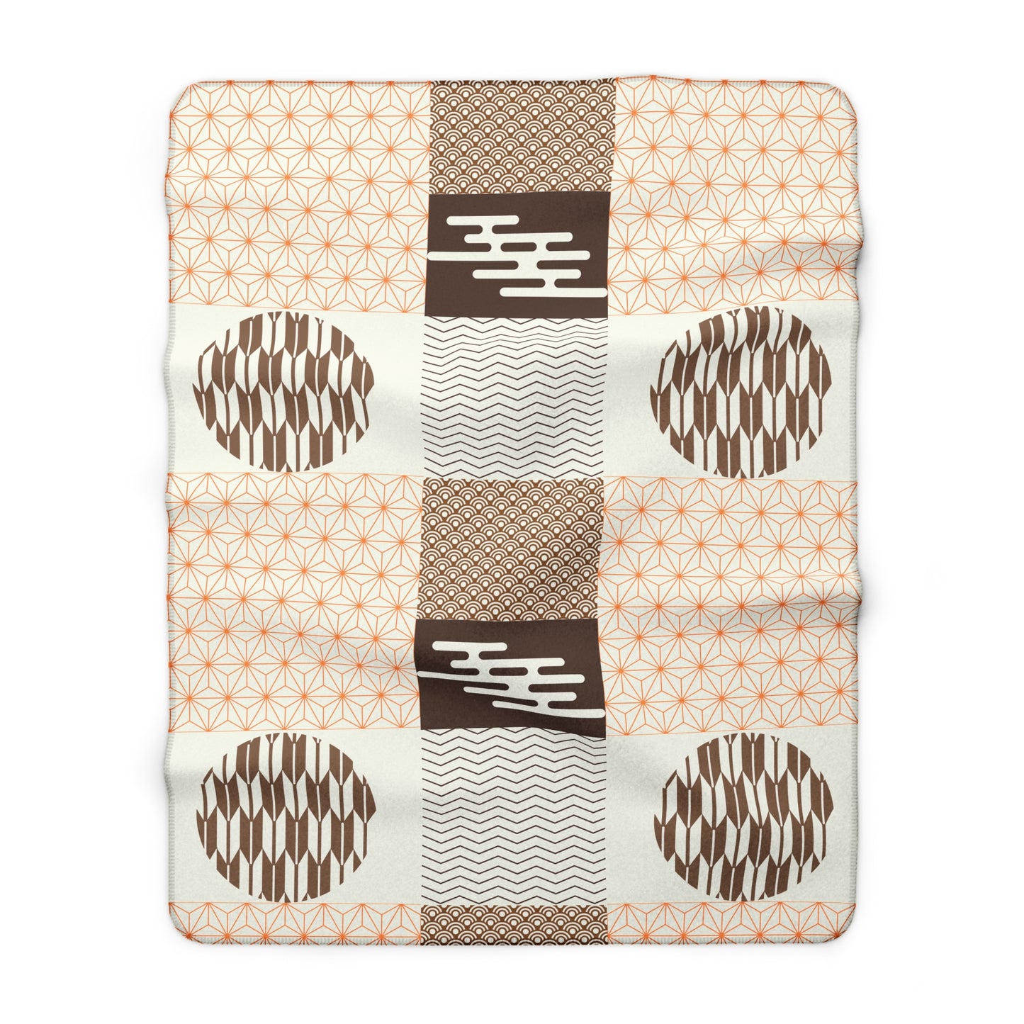 Patchwork blanket with geometric patterns on a white background