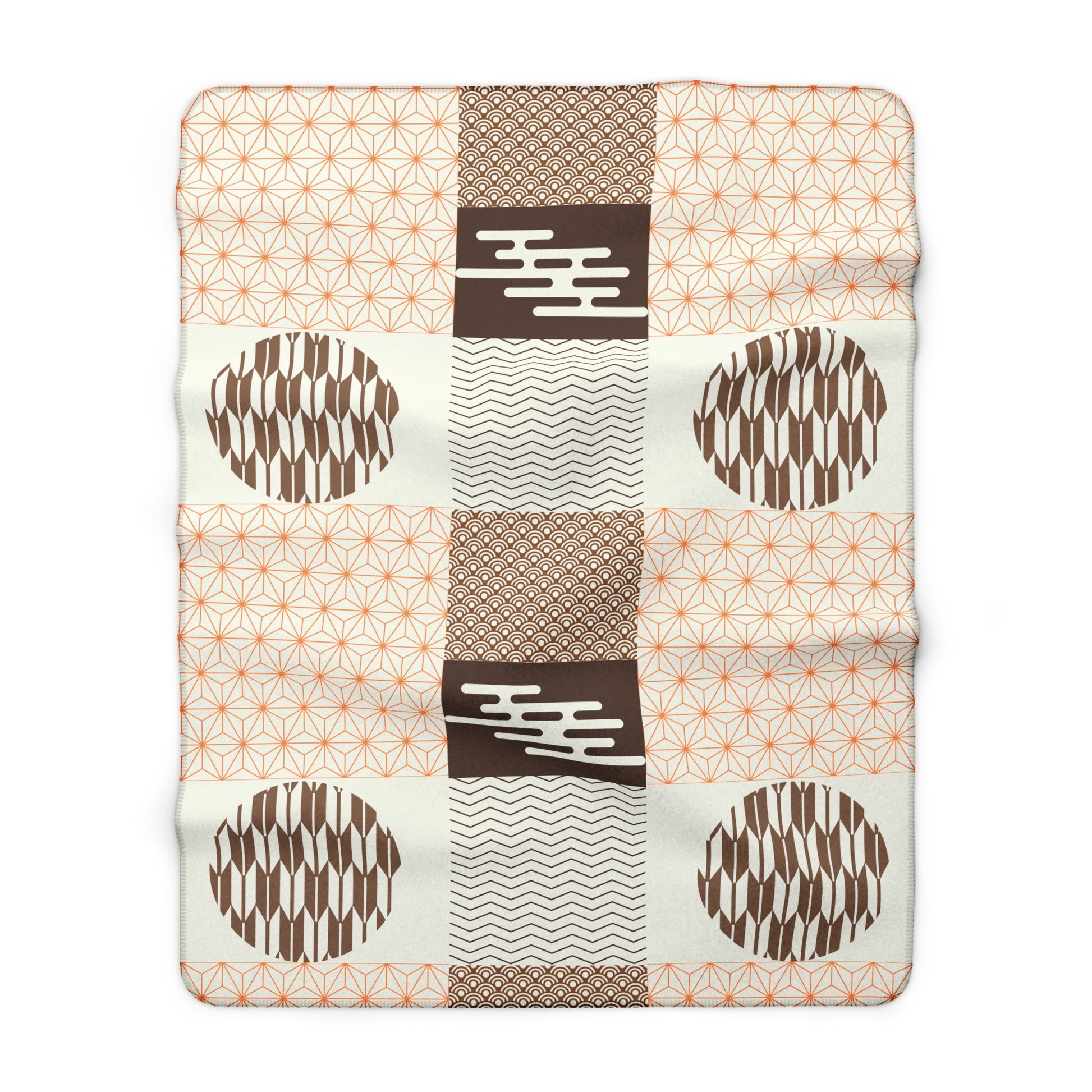 Patchwork blanket with geometric patterns on a white background