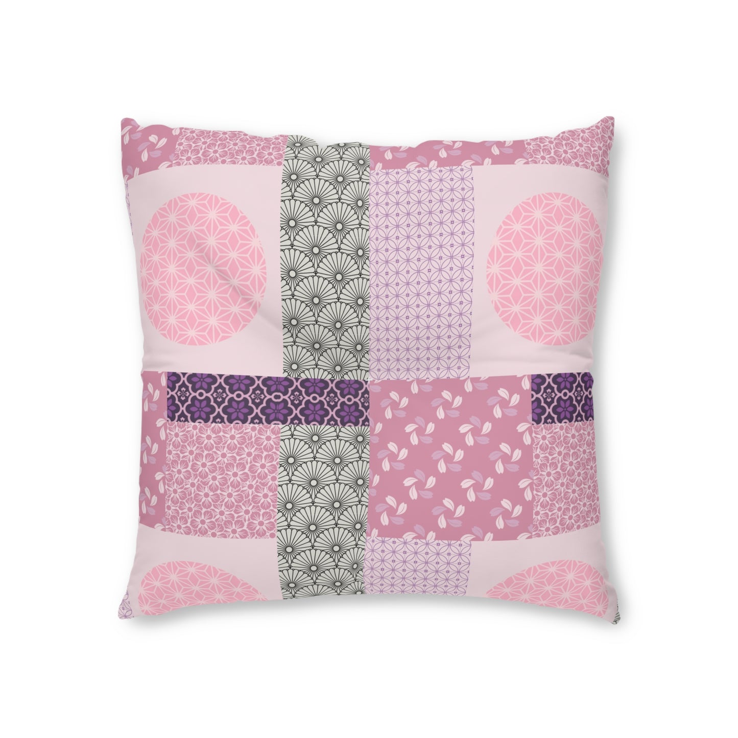 A square decorative throw pillow featuring a patchwork design of various pink, purple, and gray geometric and floral patterns on a white background.