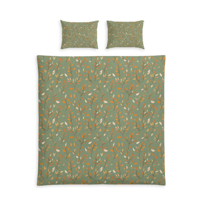 A bedding set featuring a duvet cover and two matching pillowcases, all in a deep red color with a repeating pattern of small white polka dots, shown against a plain white background.