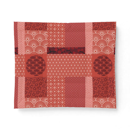 Red and white patterned fabric on a white background. Cotton Heritage