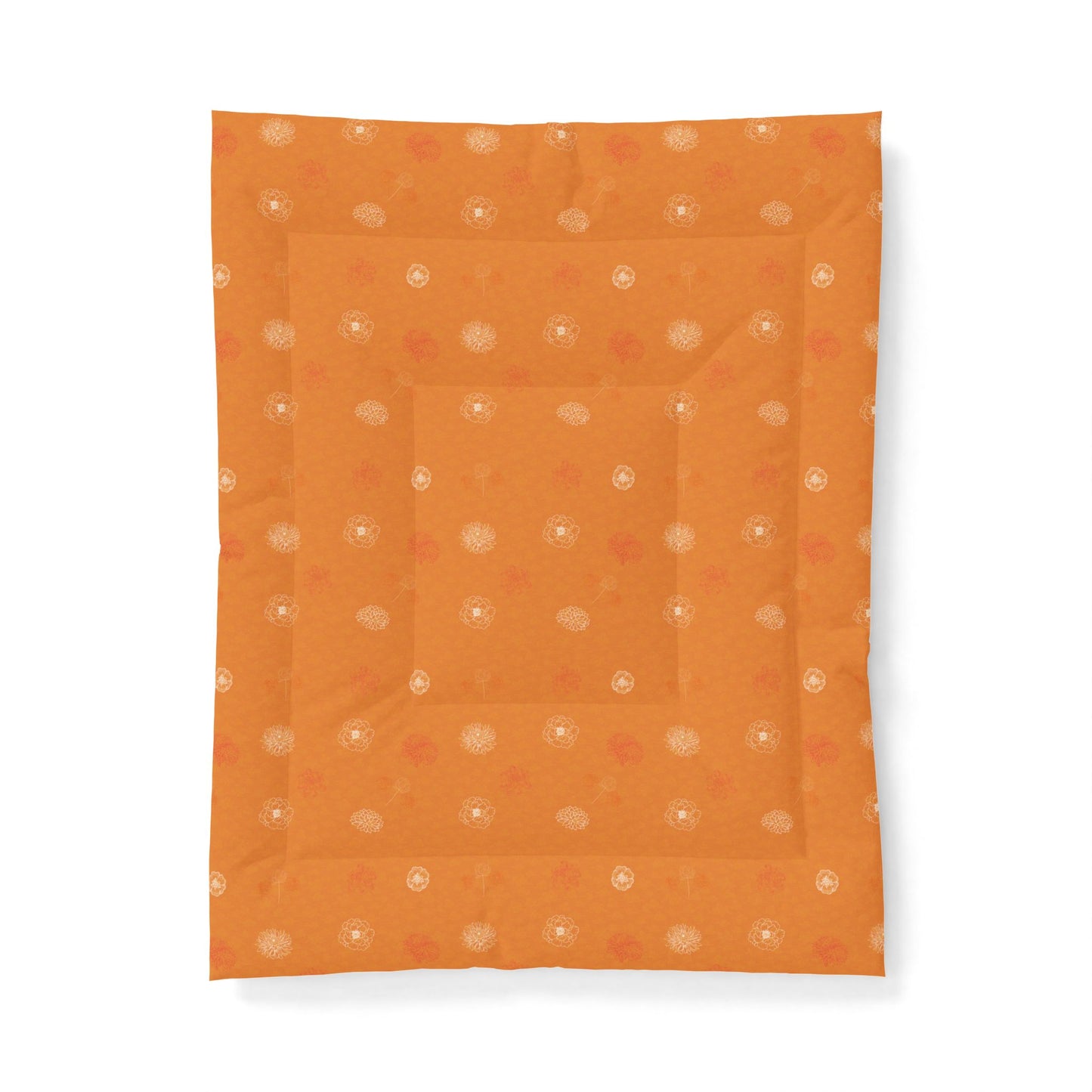 An orange quilted baby blanket with a subtle pattern of small white and orange dots, shown flat against a white background.