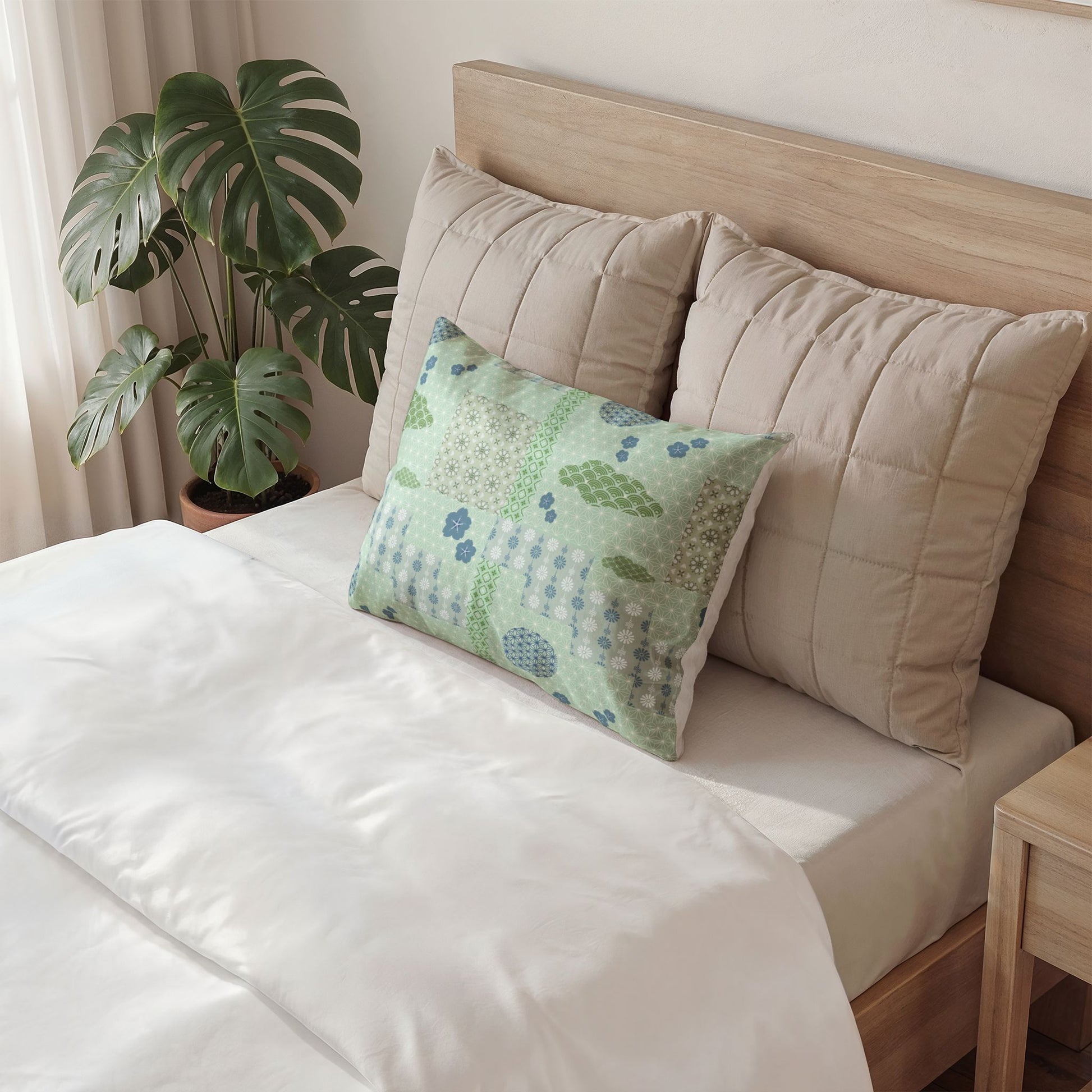 Decorative pillow with colorful eye pattern on a bed in a bedroom setting.