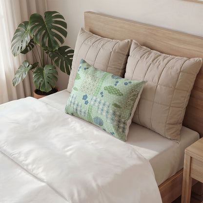 Decorative pillow with colorful eye pattern on a bed in a bedroom setting.