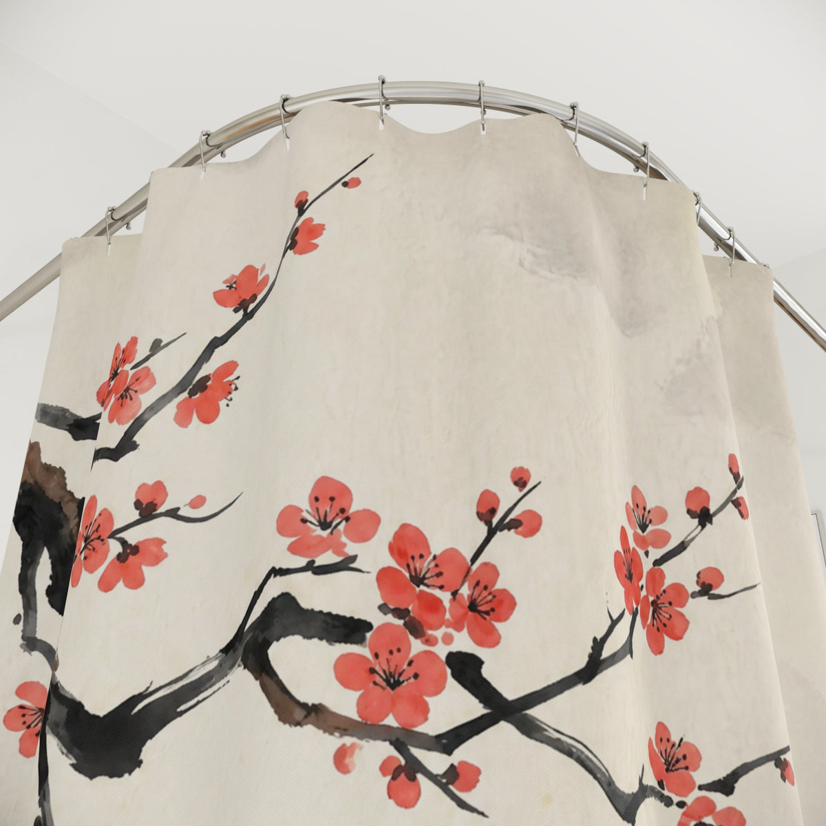 An off-white fabric shower curtain featuring a traditional Chinese-style print of red blossoms on black branches, hanging from a curved silver metal rod.