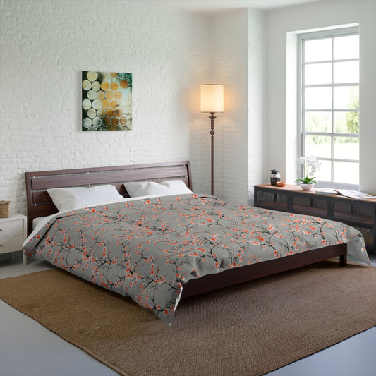 Bedroom with a bed featuring a floral comforter, wooden headboard, and side tables.
