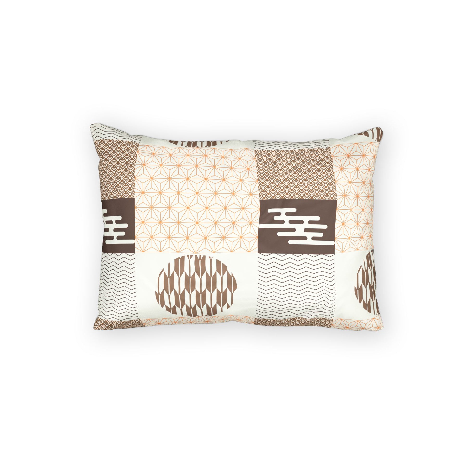A rectangular throw pillow featuring a patchwork design of geometric and Japanese-inspired patterns in brown, beige, and white, set against a plain white background.