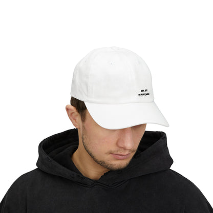 Person wearing a white cap with a logo on a white background