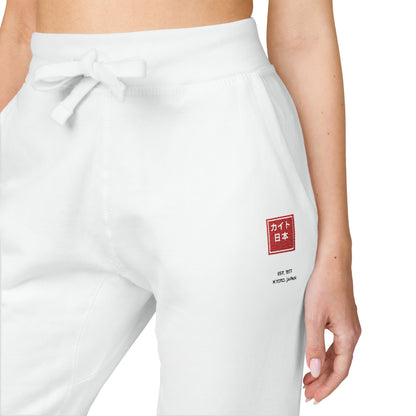 White sweatpants with a red and white logo on a white background
