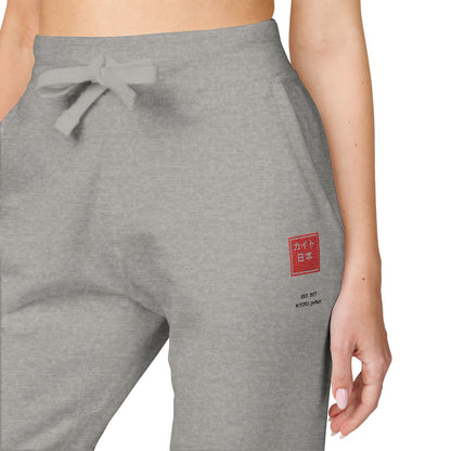 Gray sweatpants with a red logo on a white background