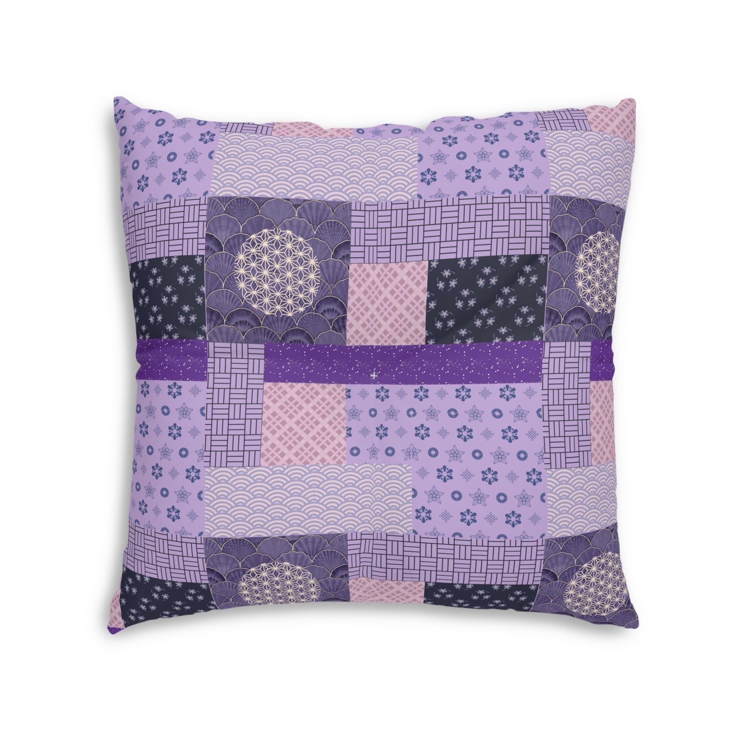 A square decorative throw pillow featuring a patchwork design of various Japanese-inspired patterns in shades of purple, pink, and navy blue, set against a plain white background.