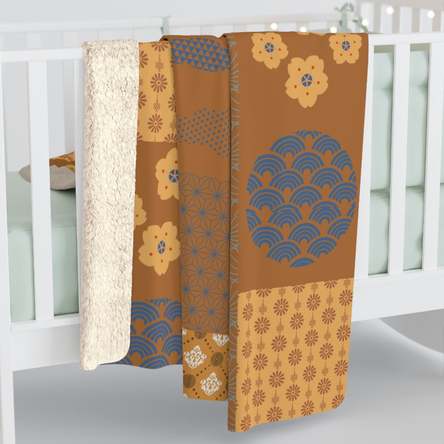 Three patterned boxes on a white surface with a blurred background