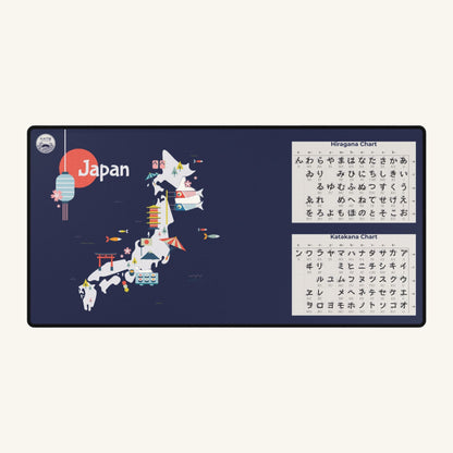 A large, dark blue desk mat featuring a stylized, colorful map of Japan. The mat also includes Hiragana and Katakana charts for learning Japanese.