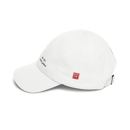 White cap with red and black logos on a white background