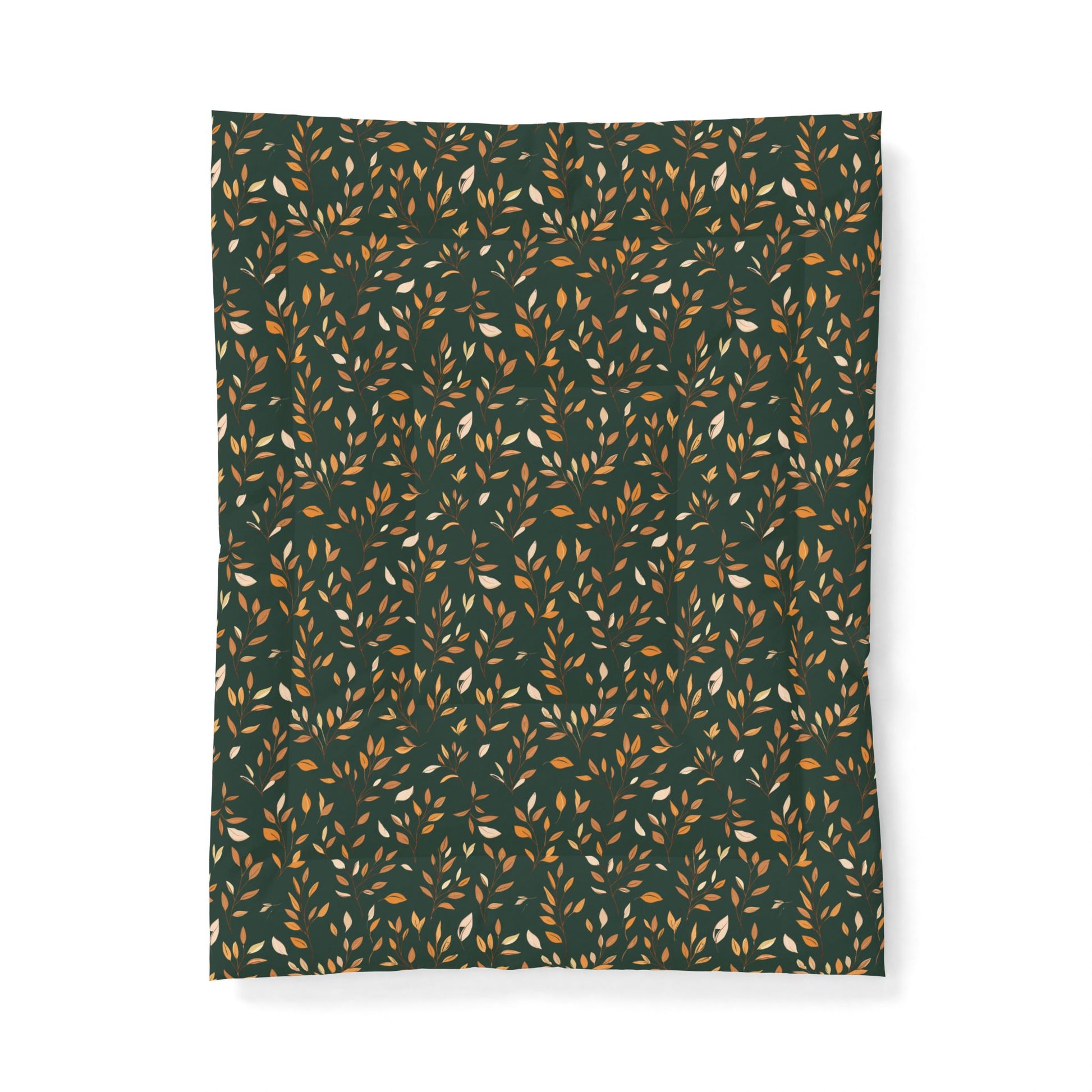 A rectangular fabric item, likely a blanket or throw, featuring an all-over repeating pattern of small leaves in warm tan, mustard, and cream on a dark forest green background.