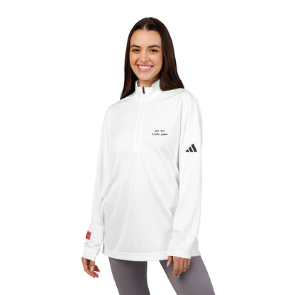 Woman wearing a white Adidas long-sleeve shirt on a white background