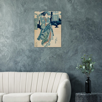 Framed artwork of a traditional Japanese scene on a textured wall above a white sofa.