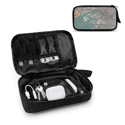 Black travel organizer with compartments containing electronic devices on a white background