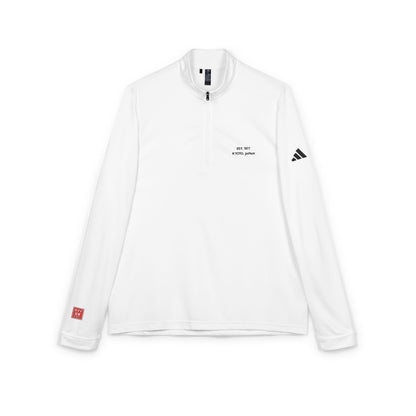 White long-sleeve shirt with black text and logos on a white background