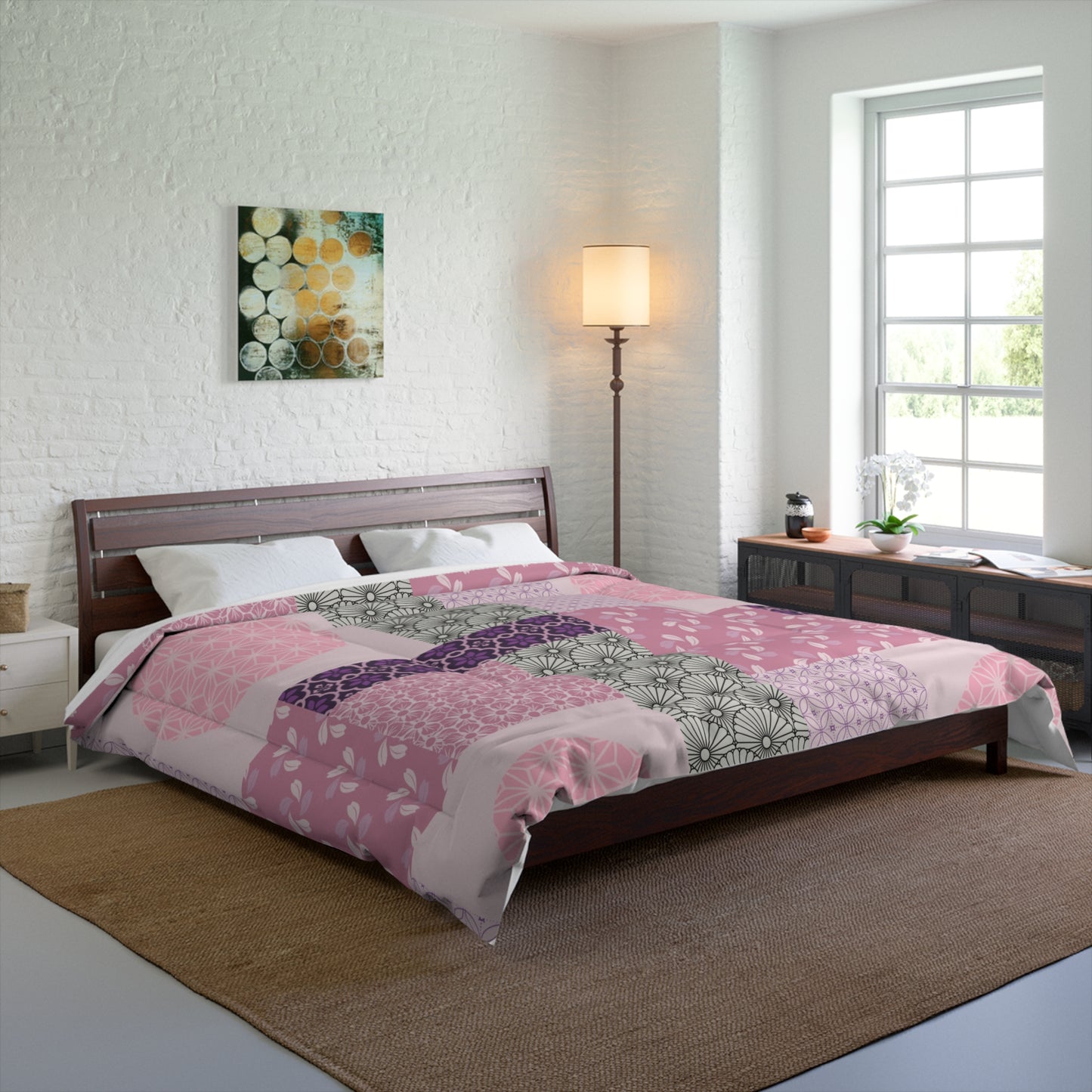 Bedroom with a bed covered in a pink and purple patchwork comforter, wooden headboard, and side tables.
