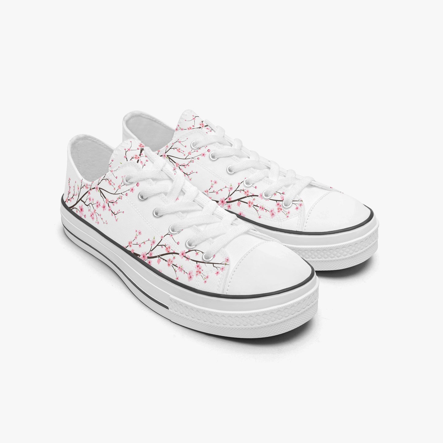 White sneakers with cherry blossom design on a white background