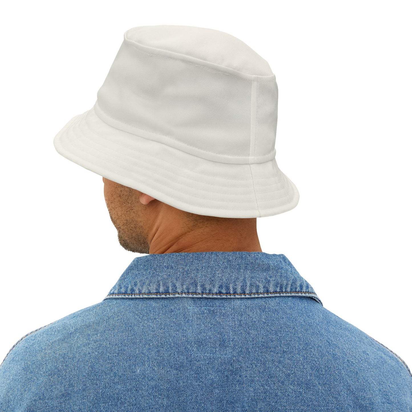 Person wearing a white bucket hat and blue denim shirt on a white background