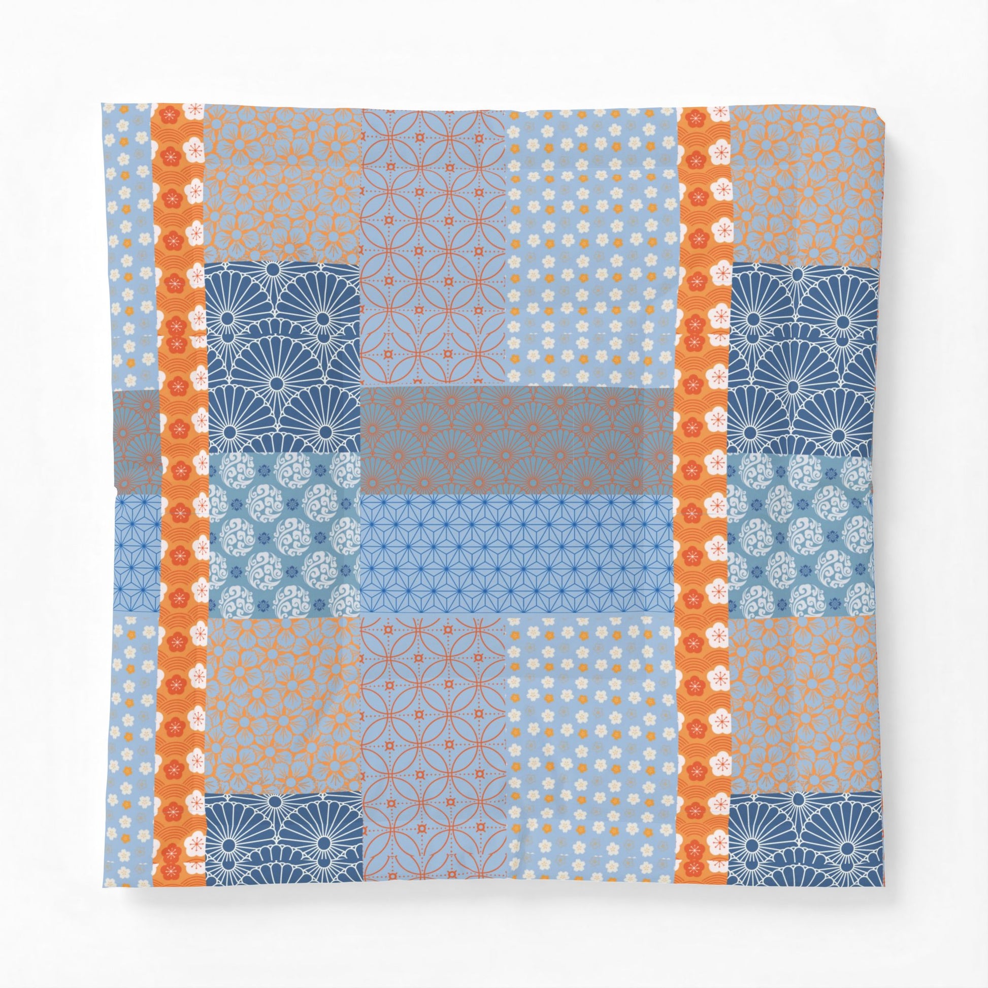 Patchwork pattern with blue, orange, and gray colors on a white background. Heritage Cotton