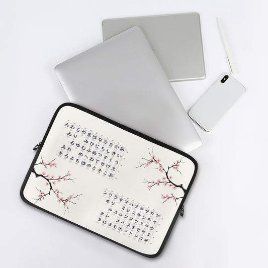 Laptop with a cherry blossom design case on a white background