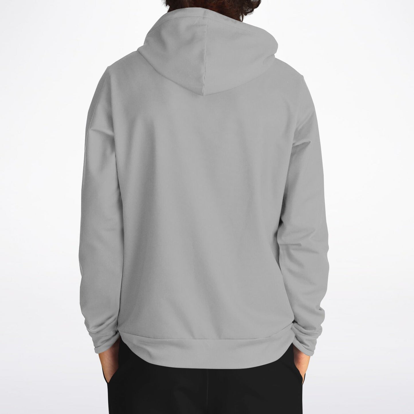 A person shown from the back wearing a plain light gray pullover hoodie with black pants, photographed against a clean white studio background.