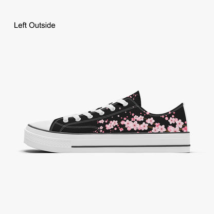 Black sneaker with pink floral pattern on a white background