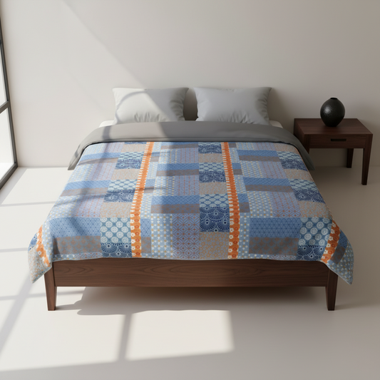 Bed with a patchwork quilt in a minimalistic bedroom