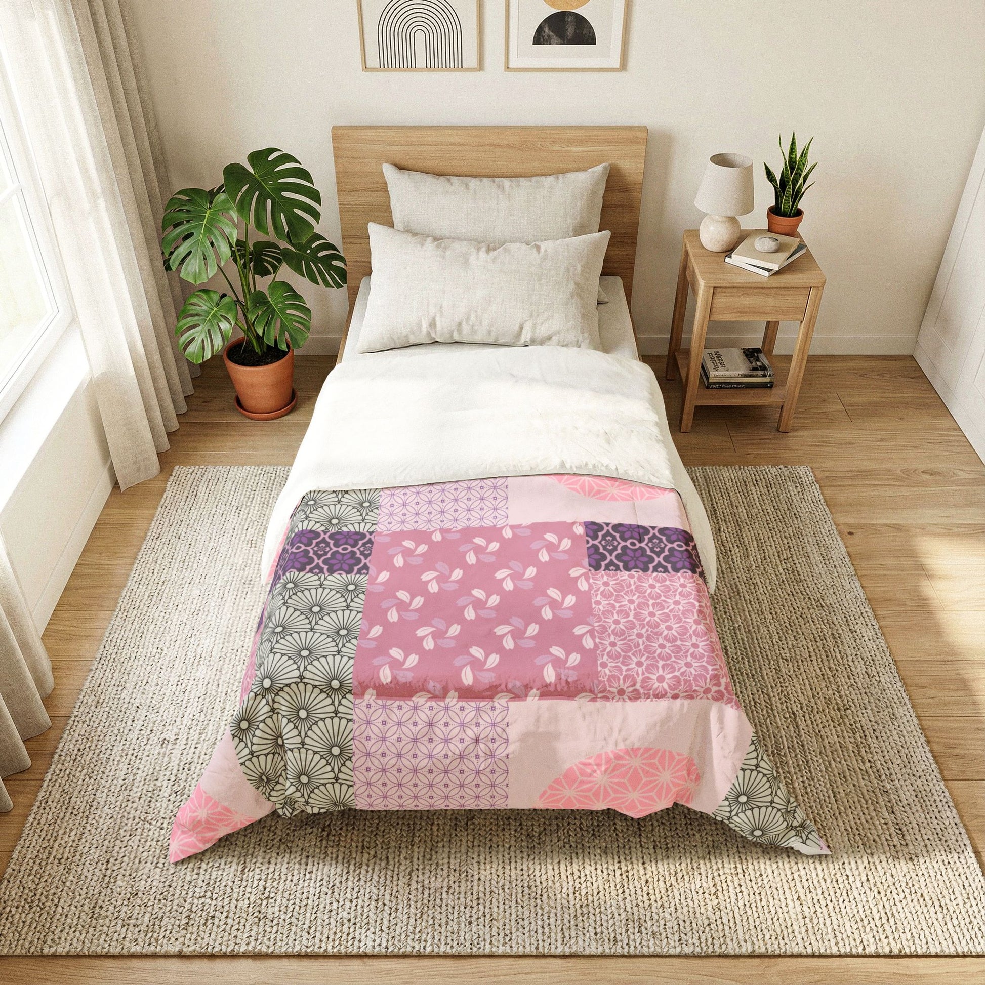 Bedroom with a bed featuring a patchwork quilt, nightstand, and decor items. Cotton Heritage