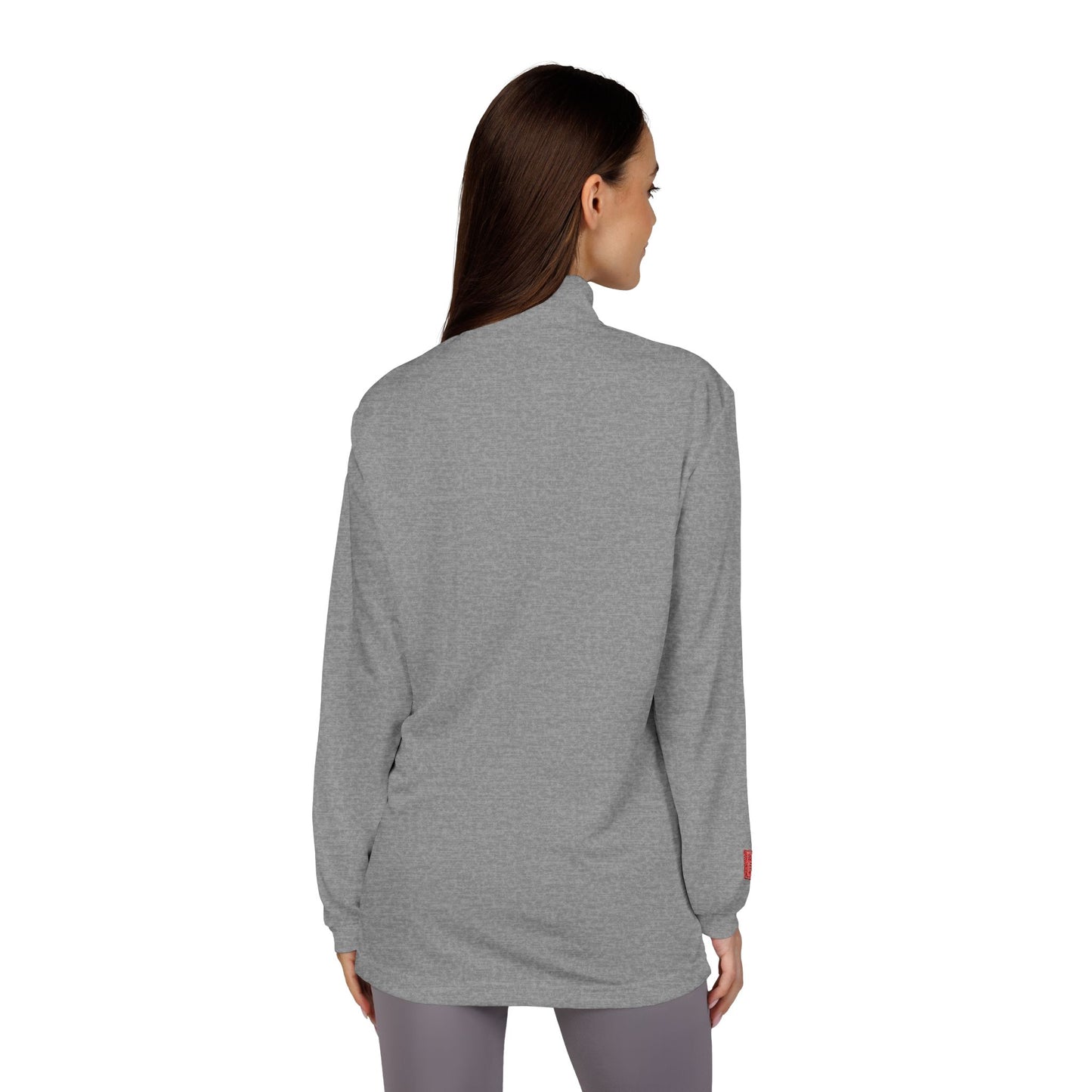 Woman wearing a gray long-sleeve top on a white background
