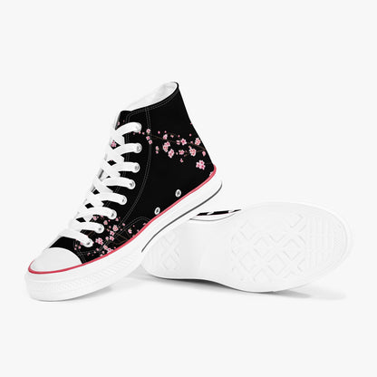 Black high-top sneakers with pink floral patterns on a white background