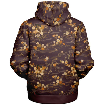A pullover hoodie shown from the back, featuring an all-over print of a Japanese landscape with cherry blossoms, deer, and a river. The base color is a dark plum purple, with the print detailed in gold, beige, and white.