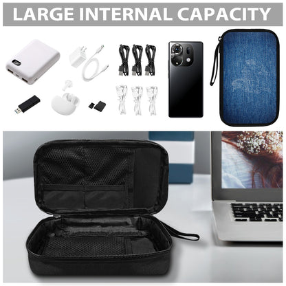 Black travel case with electronic accessories and laptop on a white surface