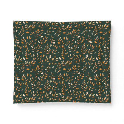 A rectangular fabric or paper product with a repeating pattern of small leafy stems on a dark forest green background, featuring warm gold and off-white accents, shown against a plain white background.