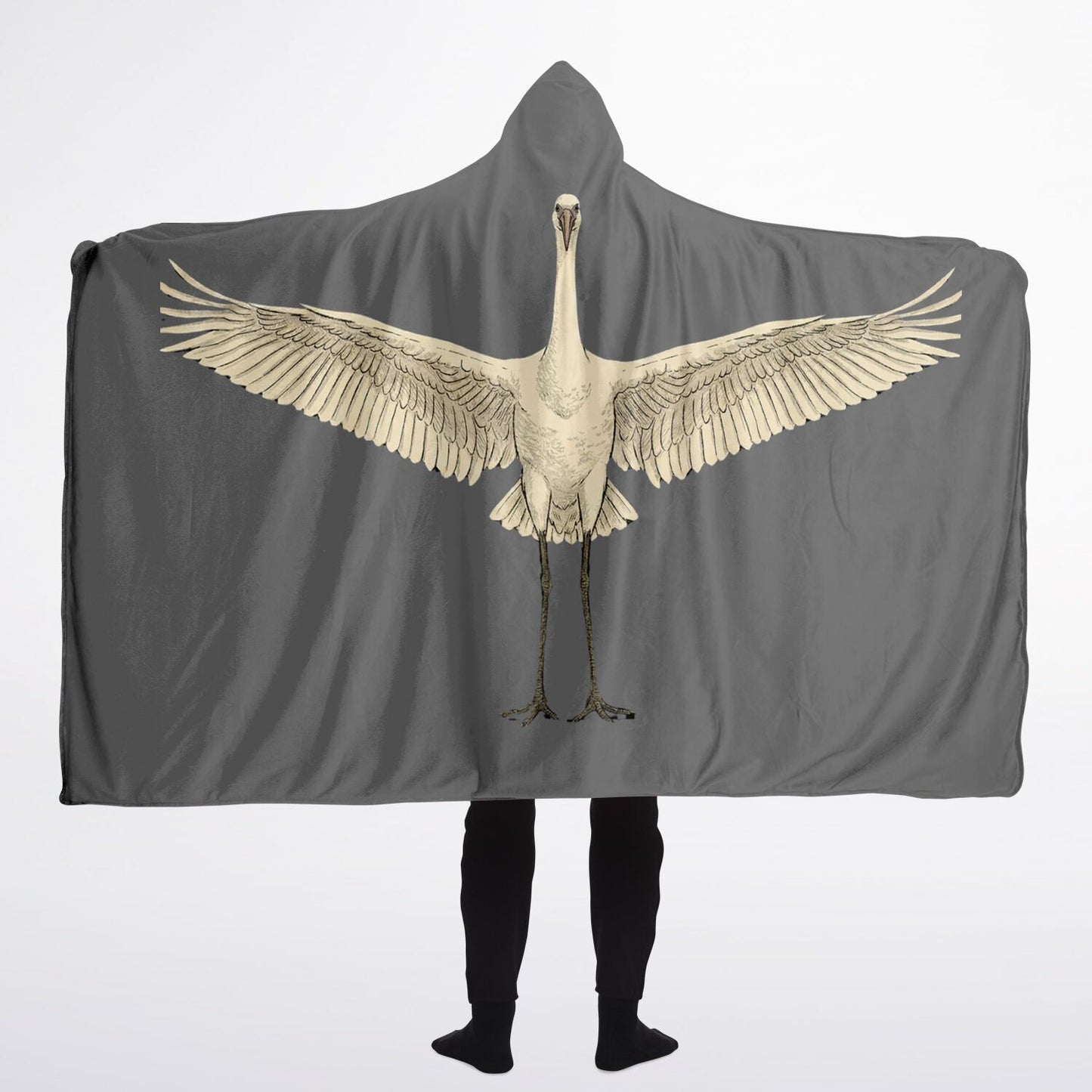 Person wearing a gray hooded blanket with a bird design on a white background