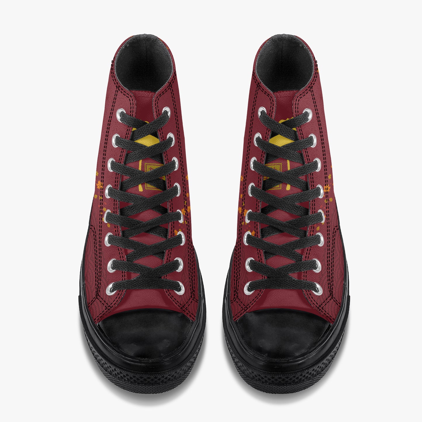 A pair of high-top sneakers shown from a top-down view, featuring a burgundy red leather upper, black laces, black rubber toe caps and soles, and small yellow accents on the sides.