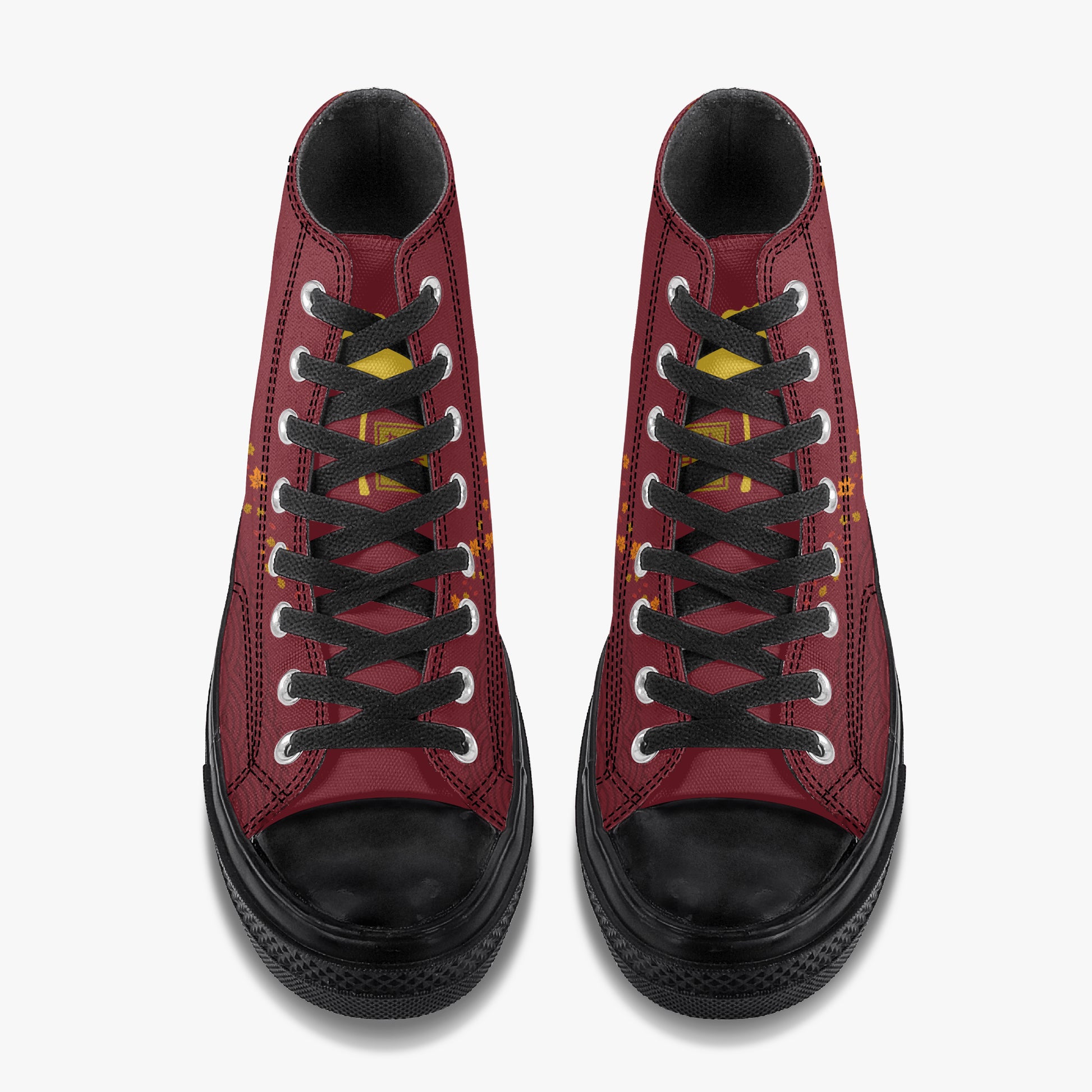 A pair of high-top sneakers shown from a top-down view, featuring a burgundy red leather upper, black laces, black rubber toe caps and soles, and small yellow accents on the sides.
