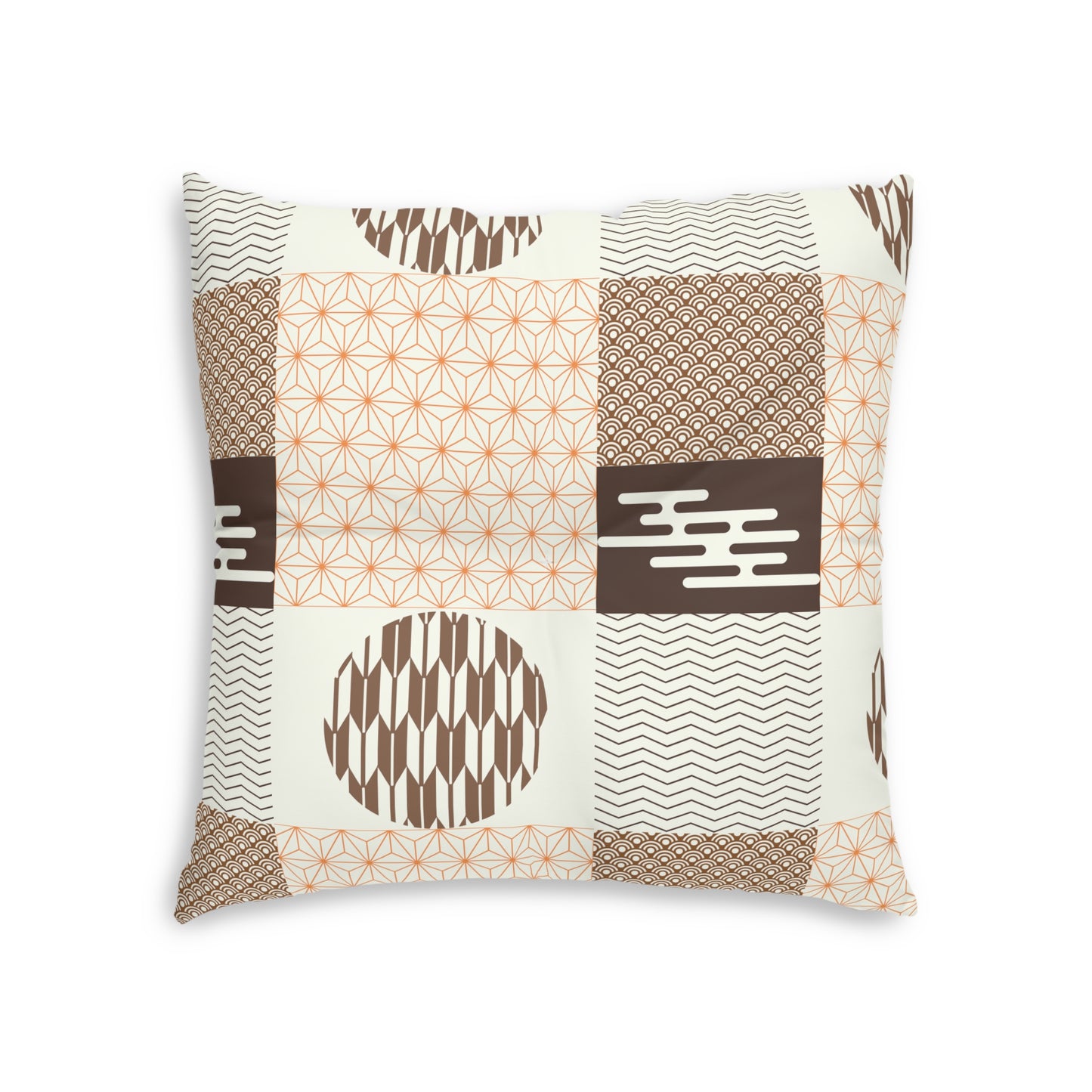 A square decorative throw pillow featuring a patchwork design of geometric and ikat-inspired patterns in brown, beige, and orange on an off-white background.