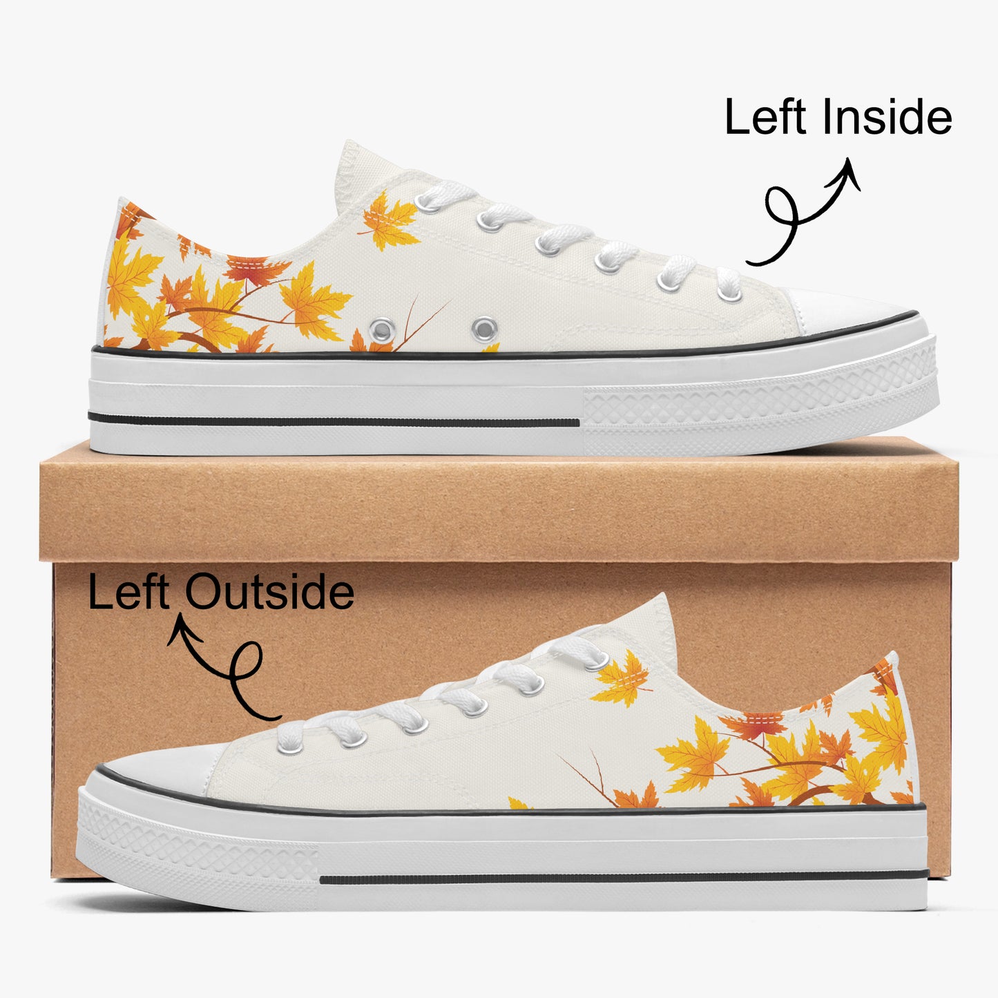 A pair of low-top canvas sneakers shown from both left inside and left outside views, stacked on a brown shoebox against a light gray background. The shoes are white with a yellow and orange autumn leaf pattern on the heel and side.