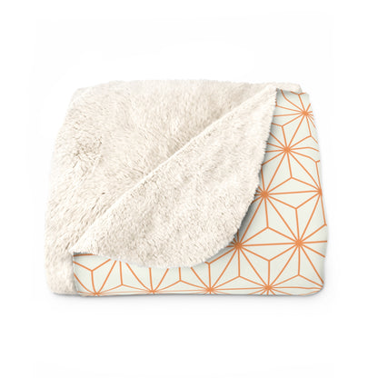 Blanket with geometric pattern on a white background