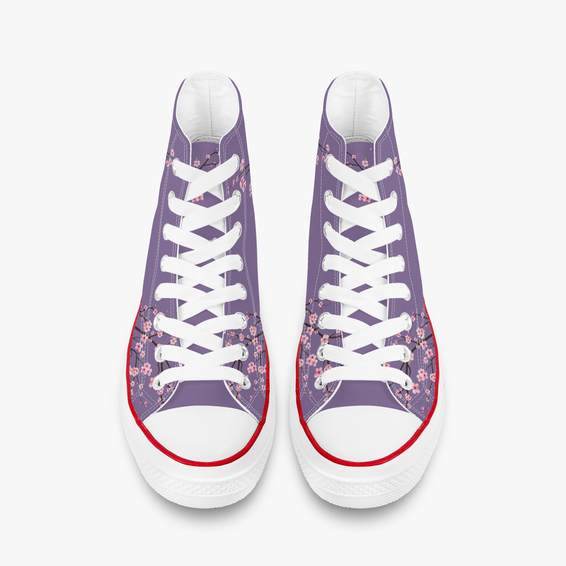 Pair of high-top sneakers with floral pattern on a white background