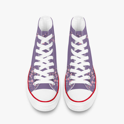 Pair of high-top sneakers with floral pattern on a white background