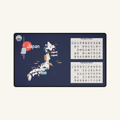A large, dark blue desk mat featuring a stylized, colorful map of Japan. The mat also includes Hiragana and Katakana charts for learning Japanese.